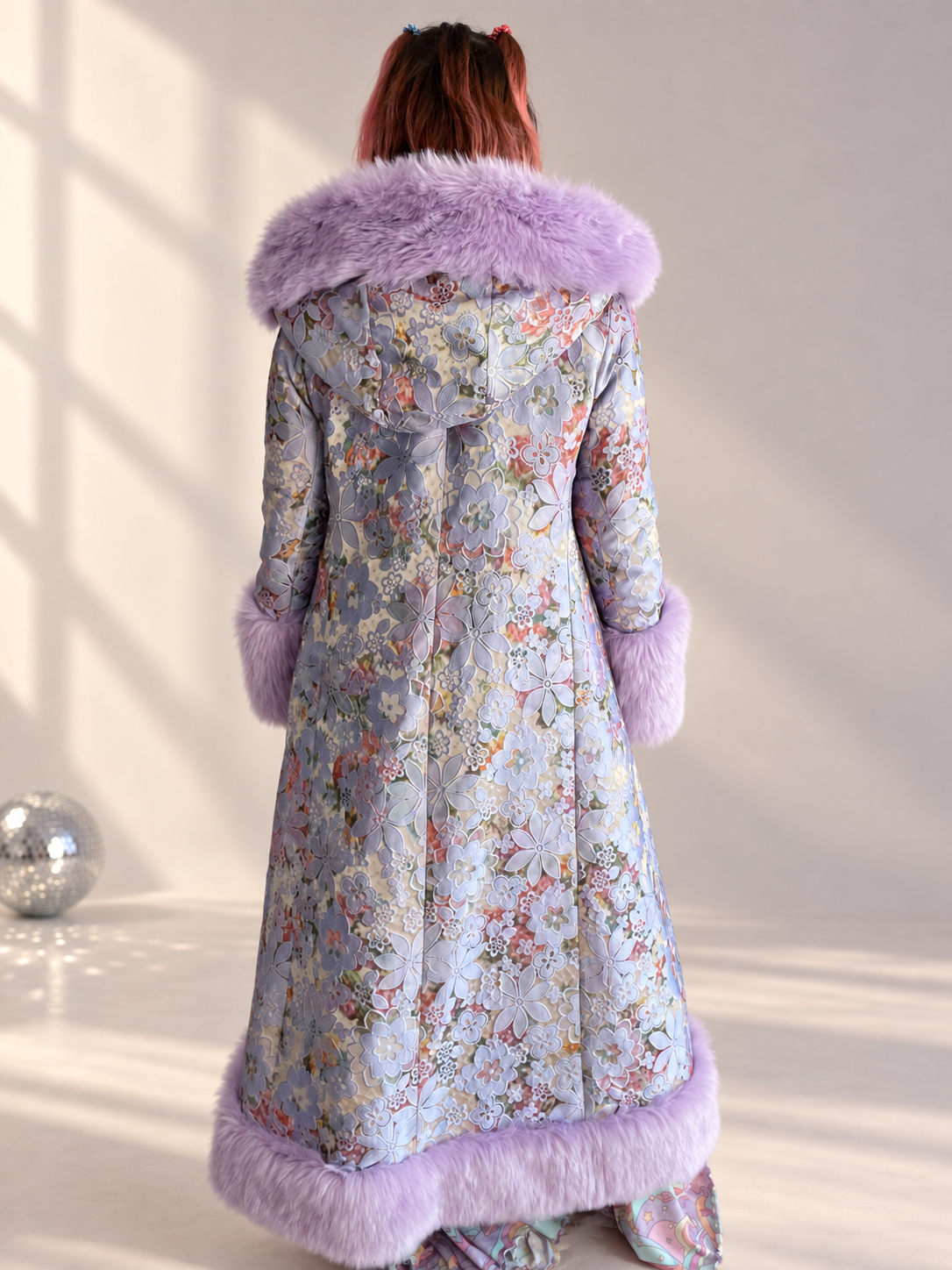 Back view of Lilac Princess floral brocade coat with lilac faux fur hood, cuffs, and hem